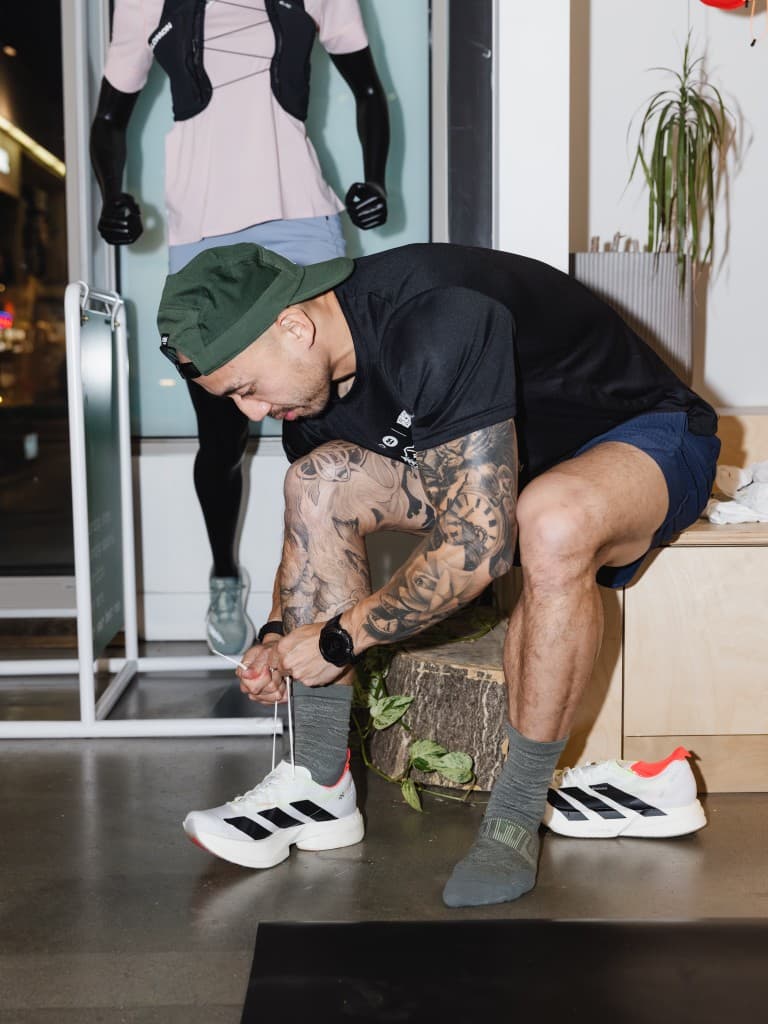 Runner trying on adidas Adizero footwear