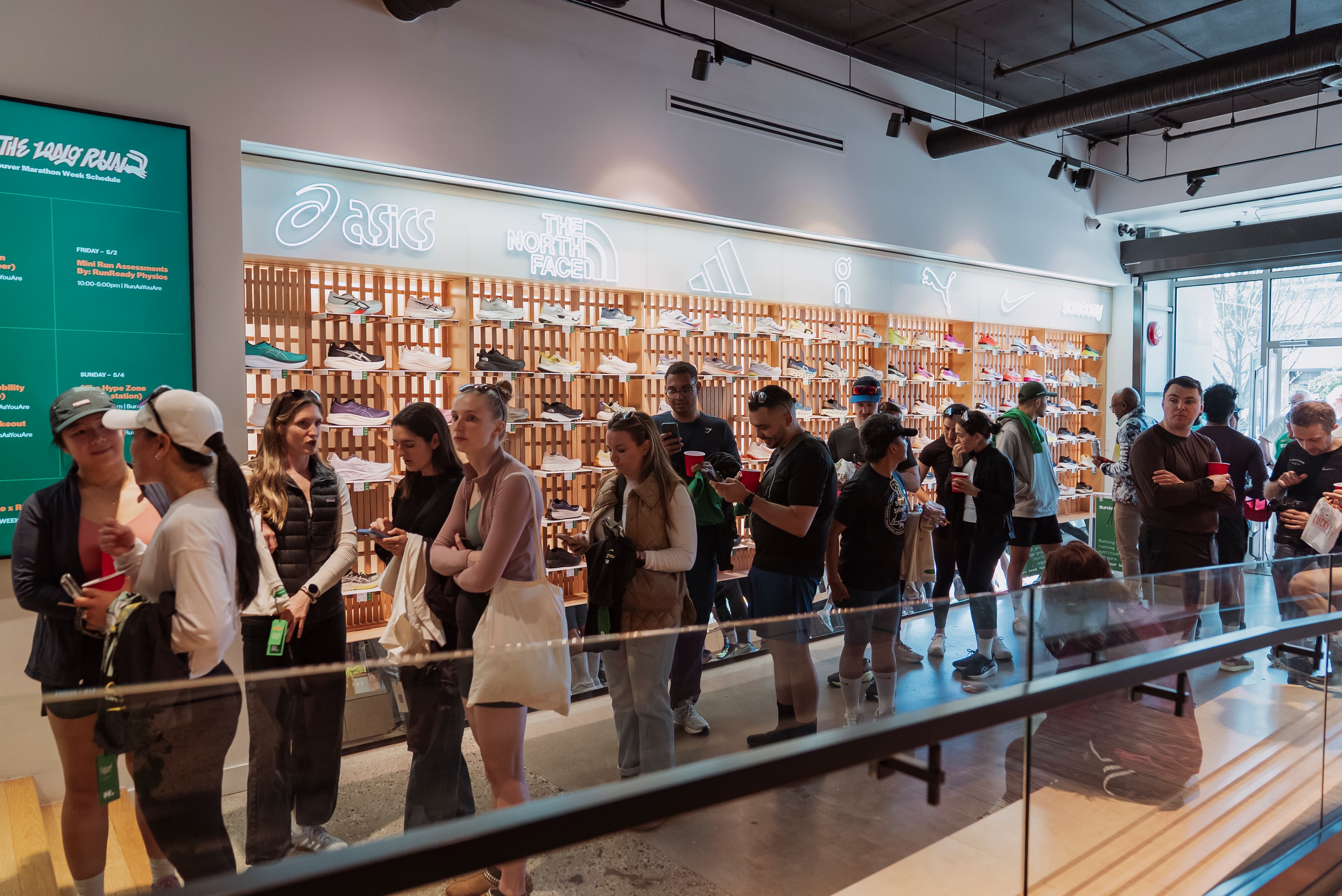 A runner trying footwear at RunAsYouAre in Toronto